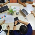 team-meeting Team meetings with several laptops