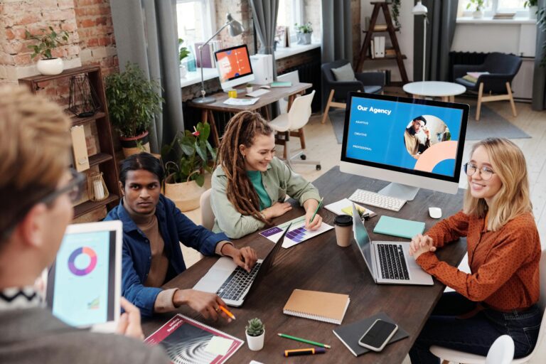 Busy agency office environment with team members working collaboratively