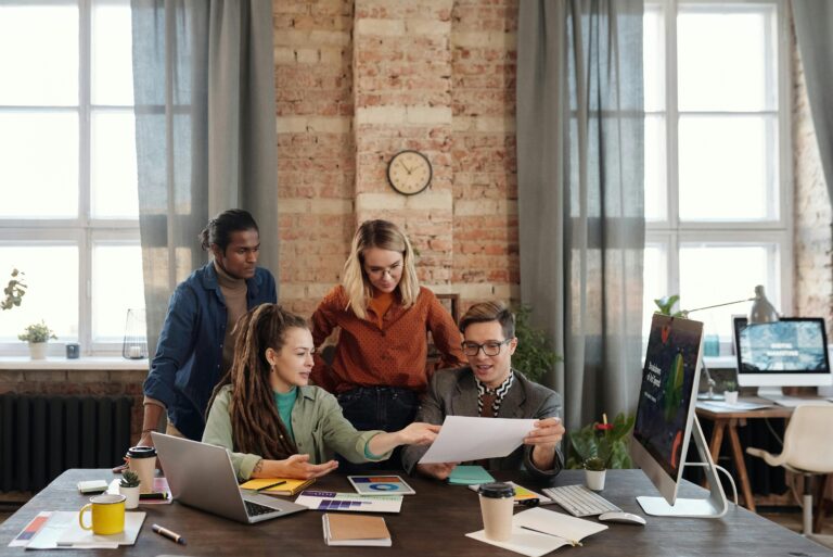 A group of colleagues having a meeting in their office