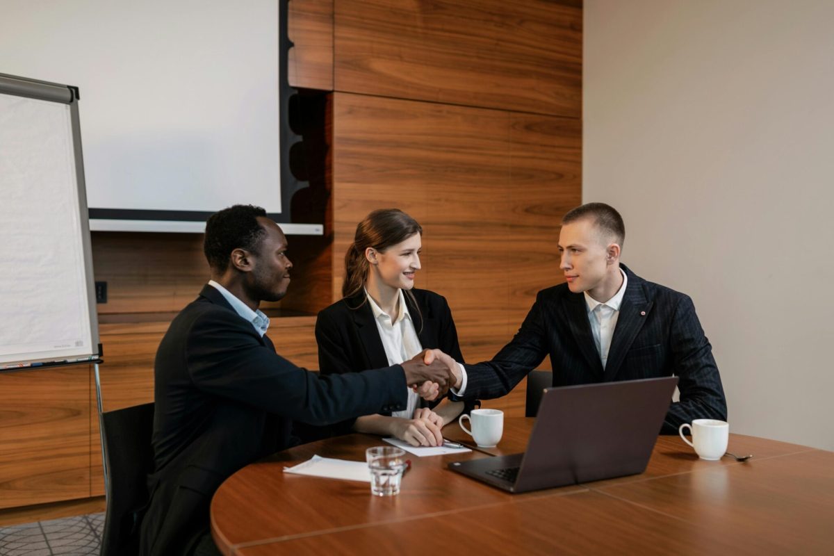A group of co-workers enjoying a friendly discussion around a table
