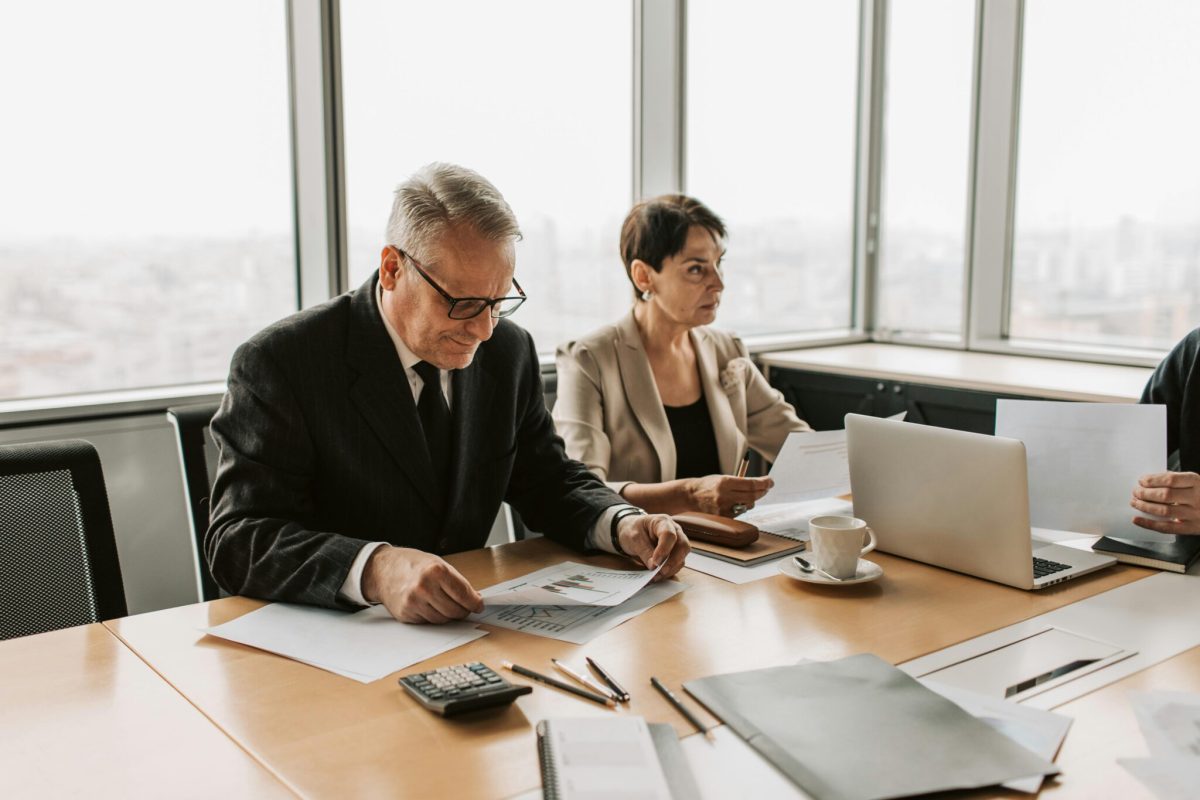 Collaborators-Working-On-Reports Executives analyzing management reports