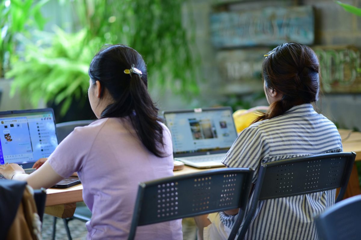 Two team members working at their computer