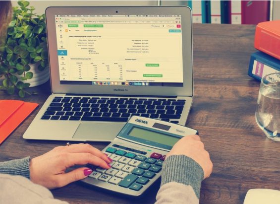 Invoice management on computer with calculator