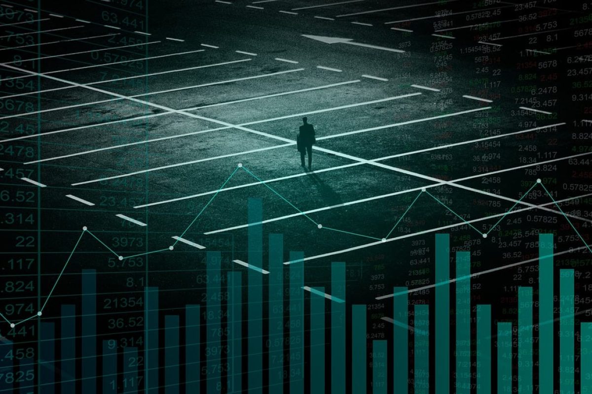 Person standing at a crossroad overlaid with financial charts and data