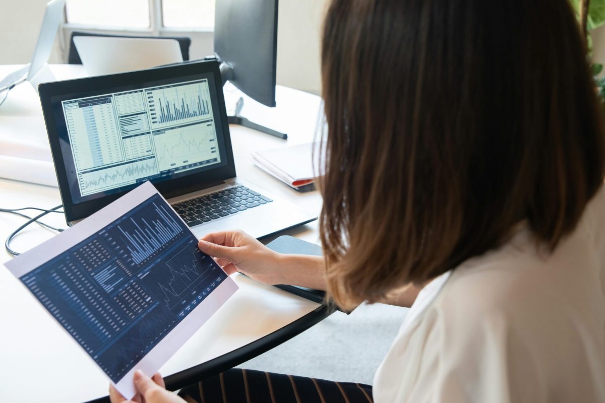 Project manager reviewing real-time insights on digital dashboards