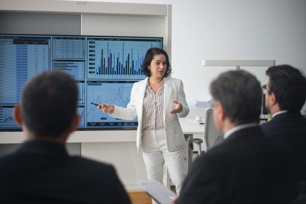 A Woman Presenting the Company's Financial Situation