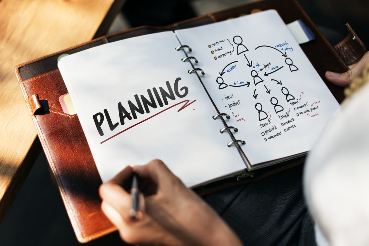 Person planning team workflow in notebook
